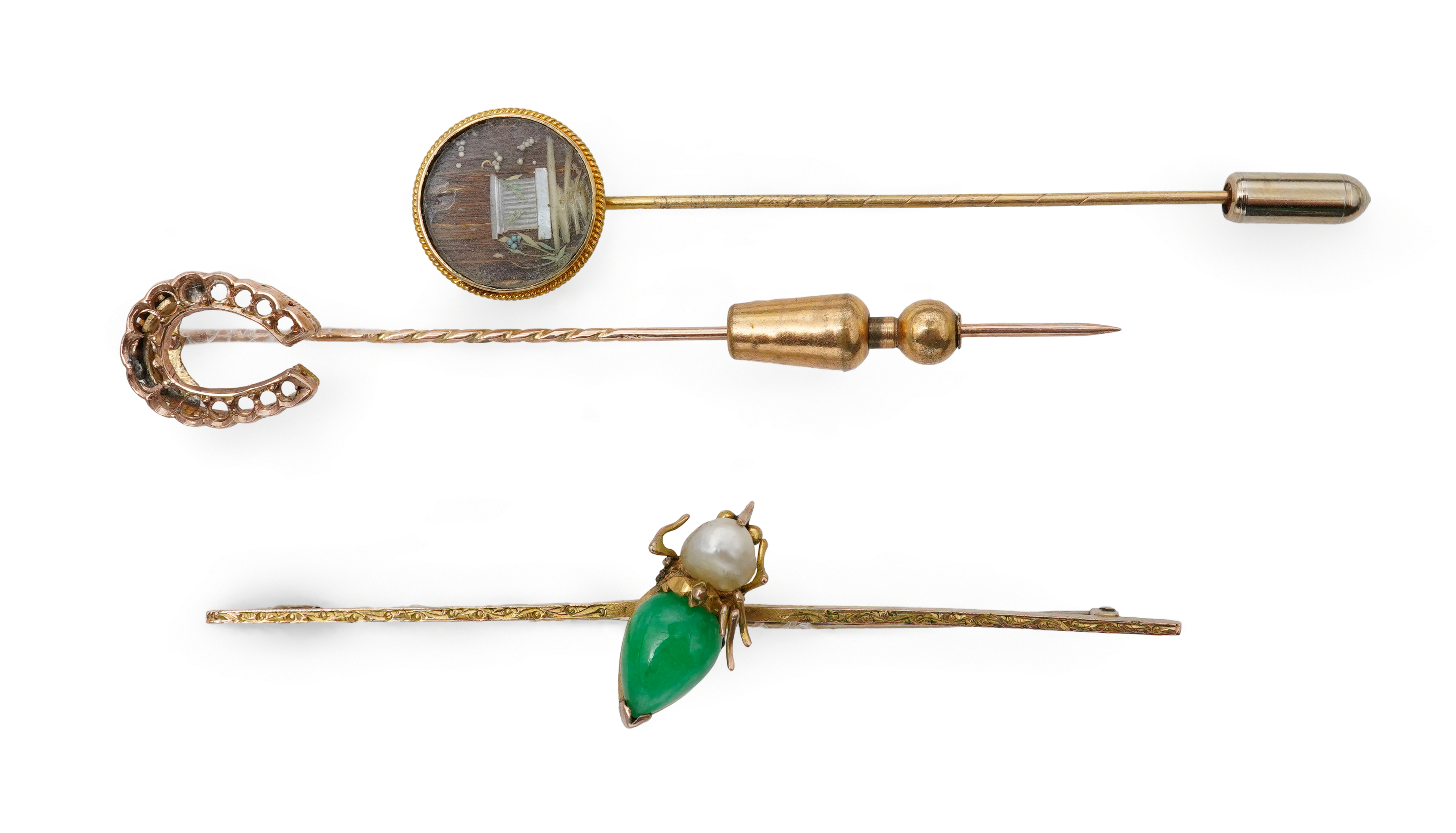 Two stick pins and a jadeite bar brooch, comprising: a bar brooch centring on an insect set with a pear-shape jadeite cabochon and a pearl, mounted in gold, length 7.5cm, stamped 14K, base metal pin; a stick pin capped w